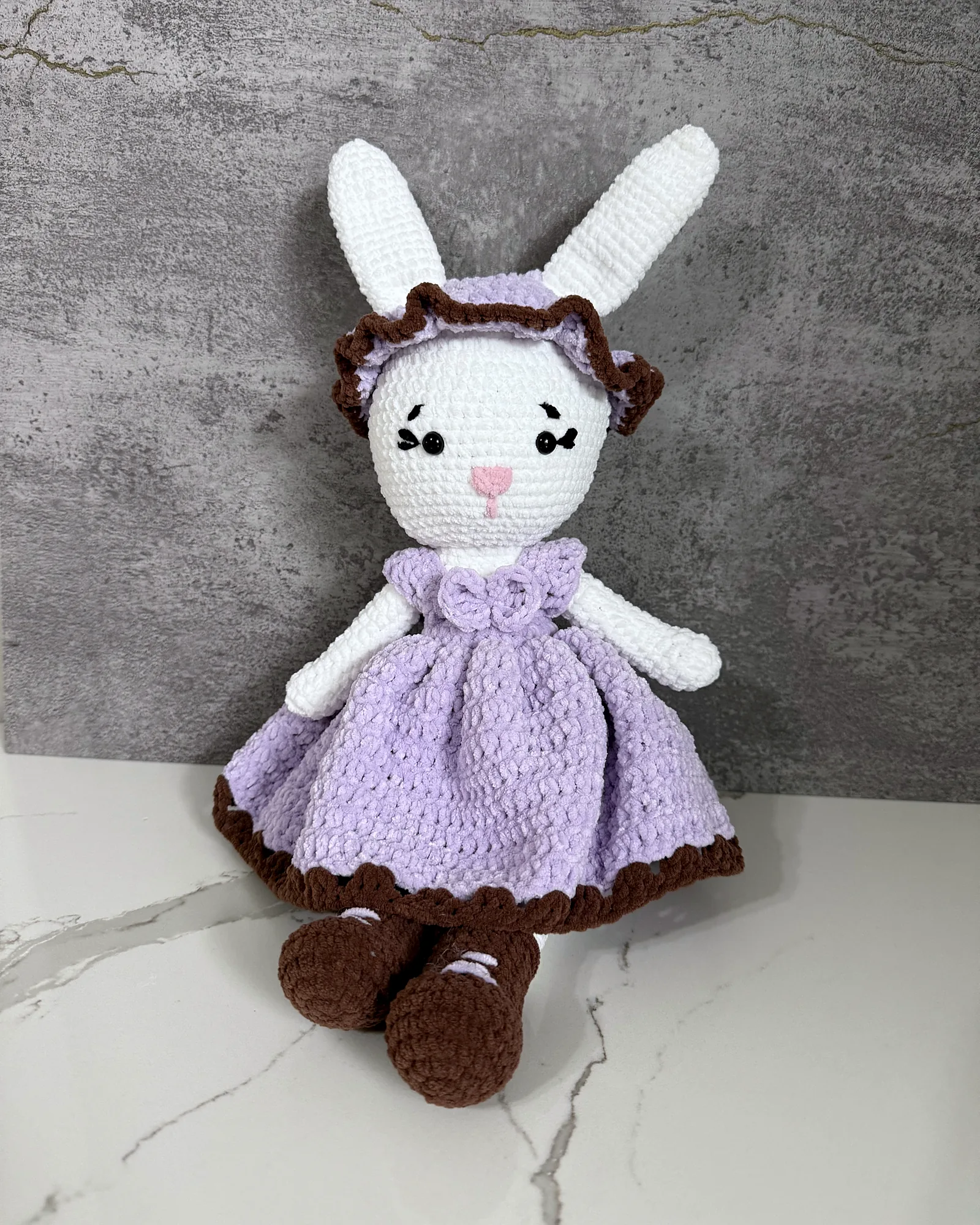 White crochet bunny in a lavender dress